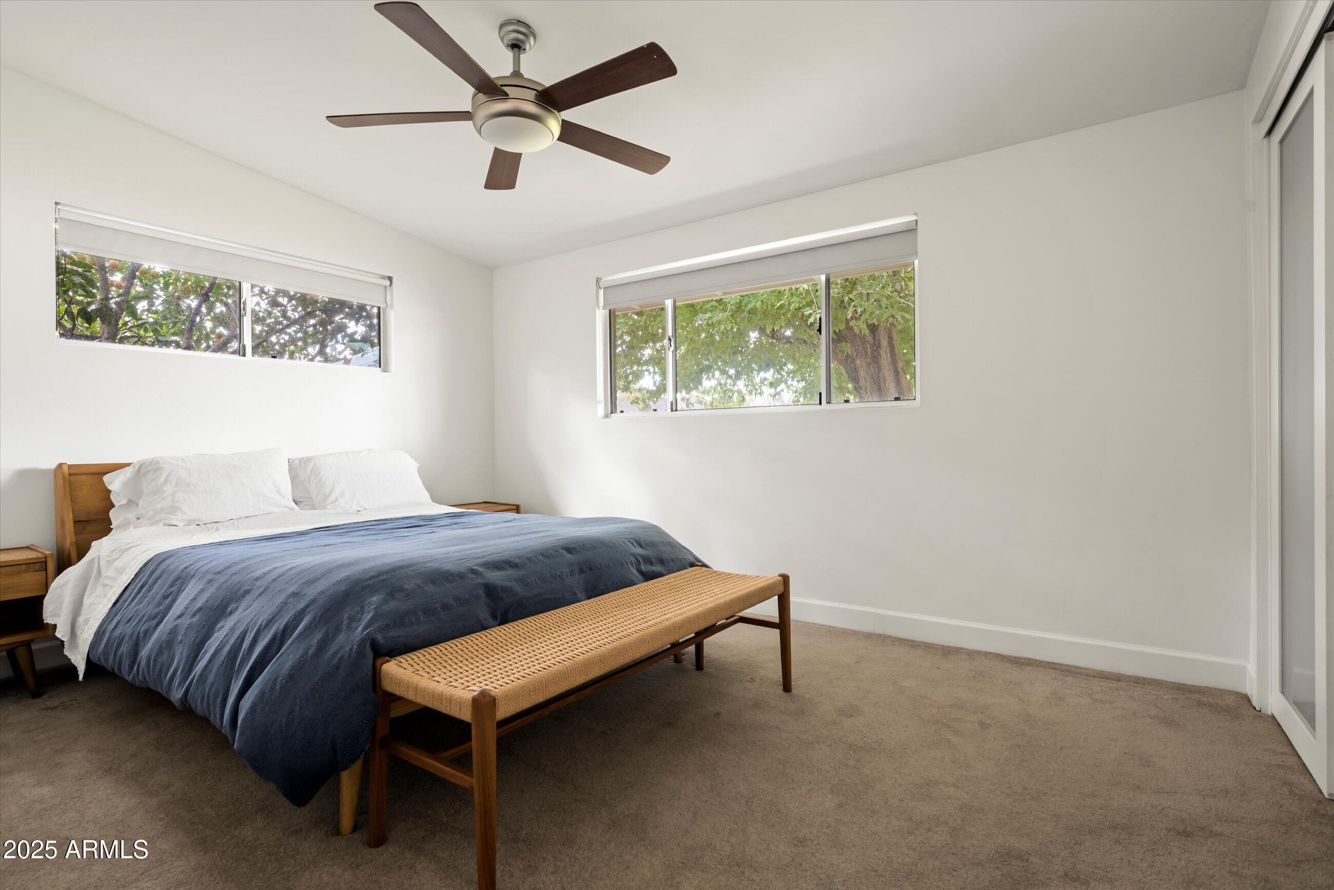 1651 East Rovey Avenue Phoenix, AZ 85016 - Photo 24 of 44 a bedroom with a bed and a table