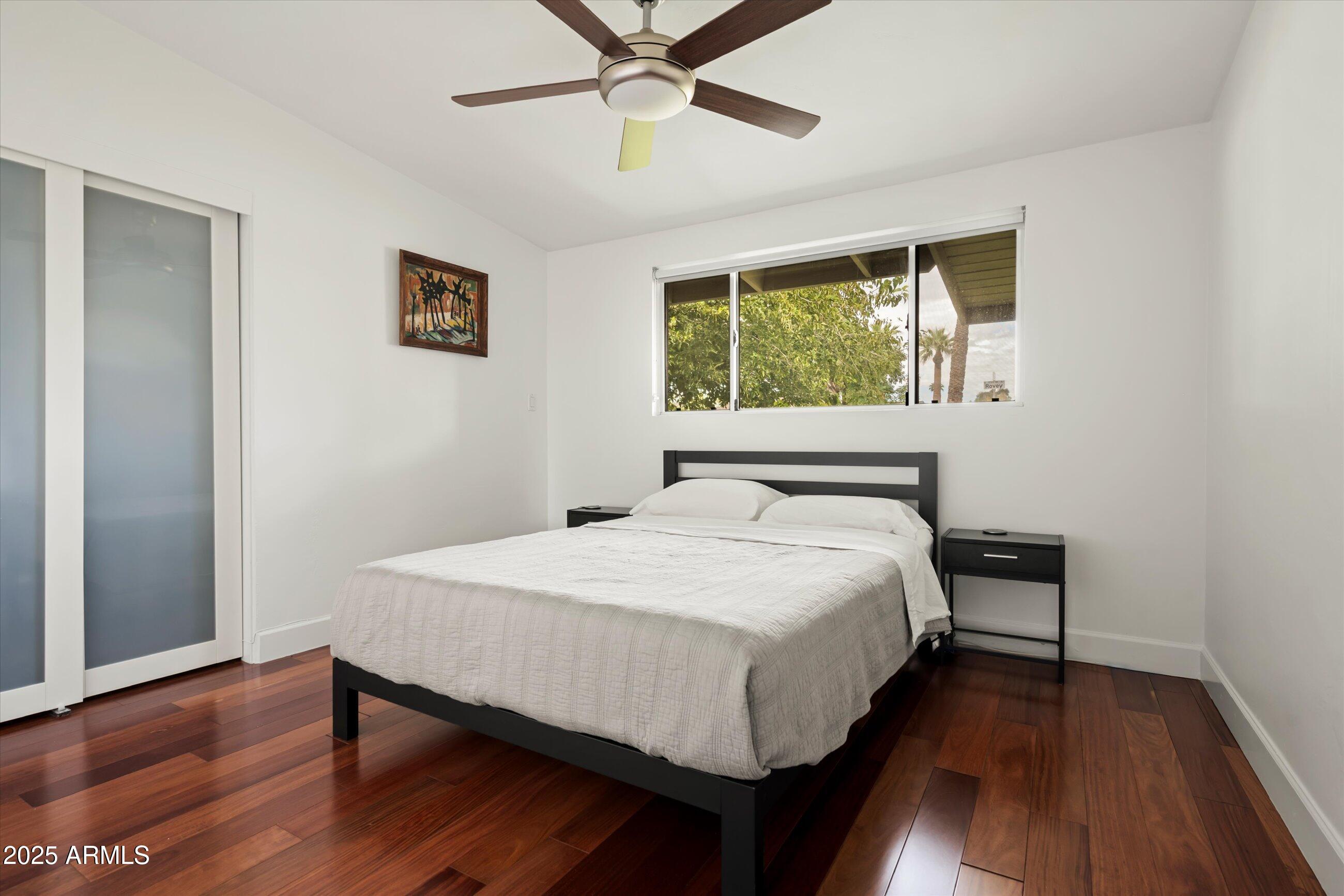 1651 East Rovey Avenue Phoenix, AZ 85016 - Photo 25 of 44 a large bed sitting in a bedroom next to a window