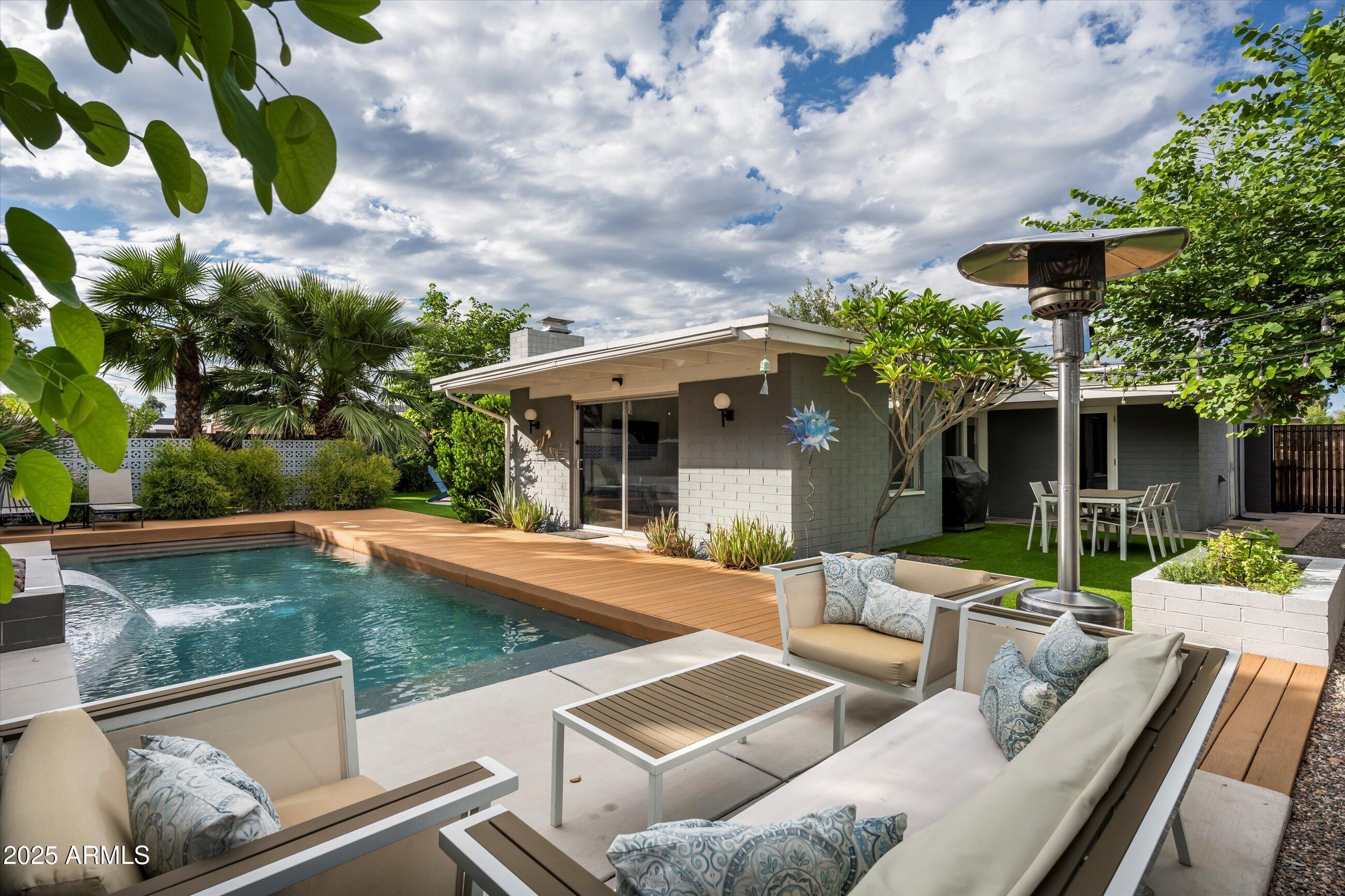 1651 East Rovey Avenue Phoenix, AZ 85016 - Photo 27 of 44 a view of a house with pool and chairs