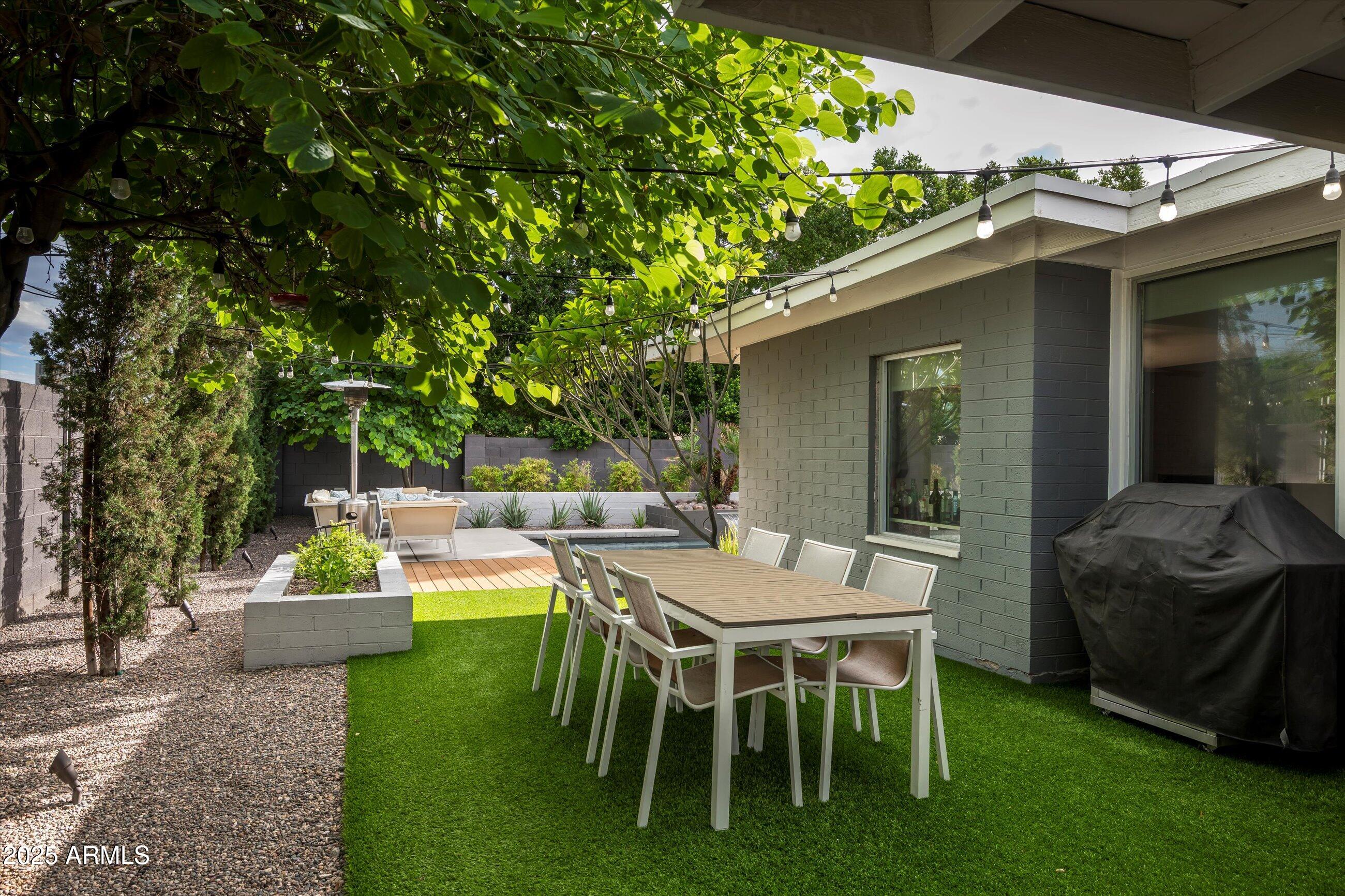 1651 East Rovey Avenue Phoenix, AZ 85016 - Photo 28 of 44 a view of a patio with table and chairs and potted plants
