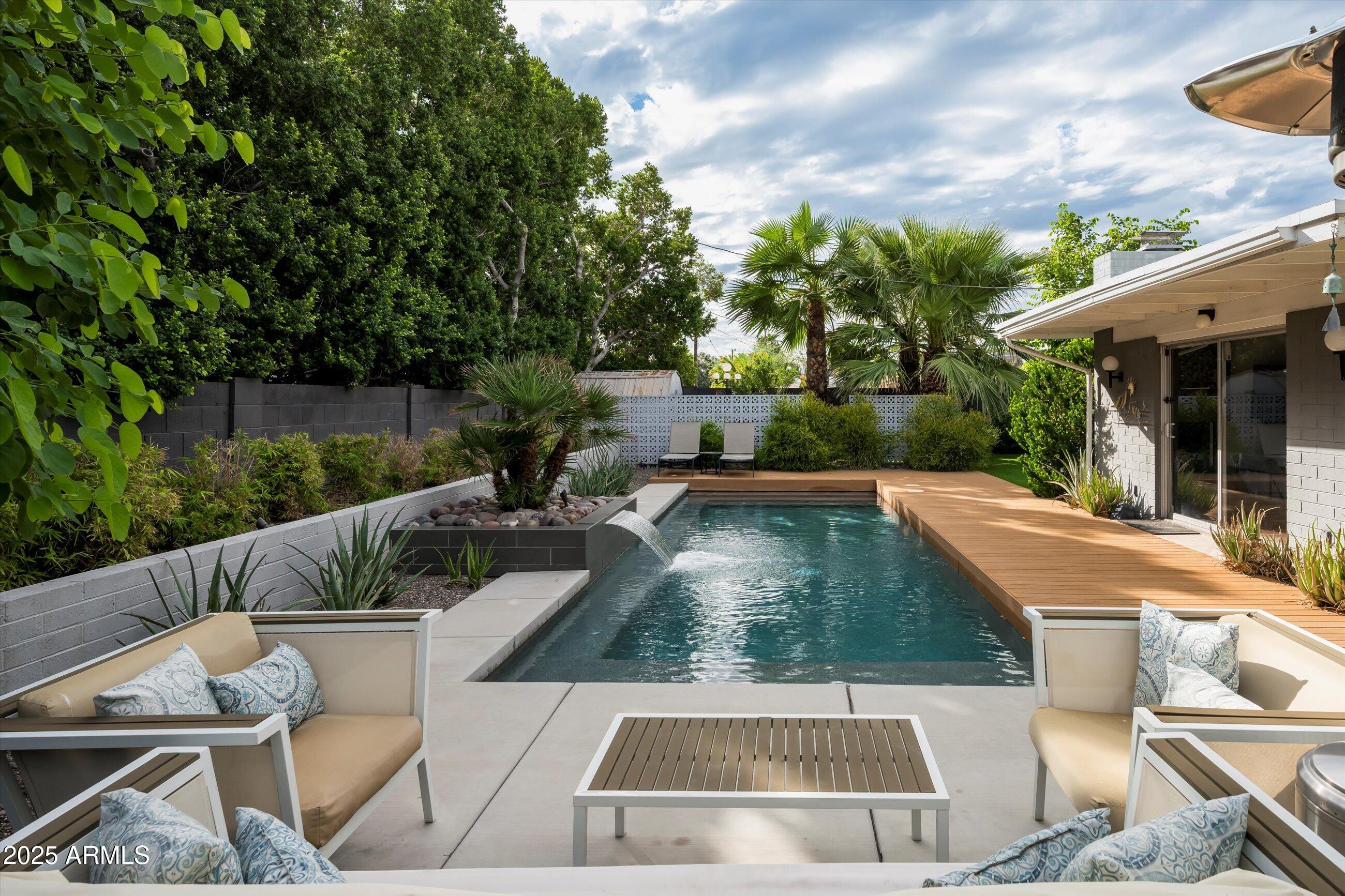 1651 East Rovey Avenue Phoenix, AZ 85016 - Photo 31 of 44 a view of house with swimming pool and outdoor seating