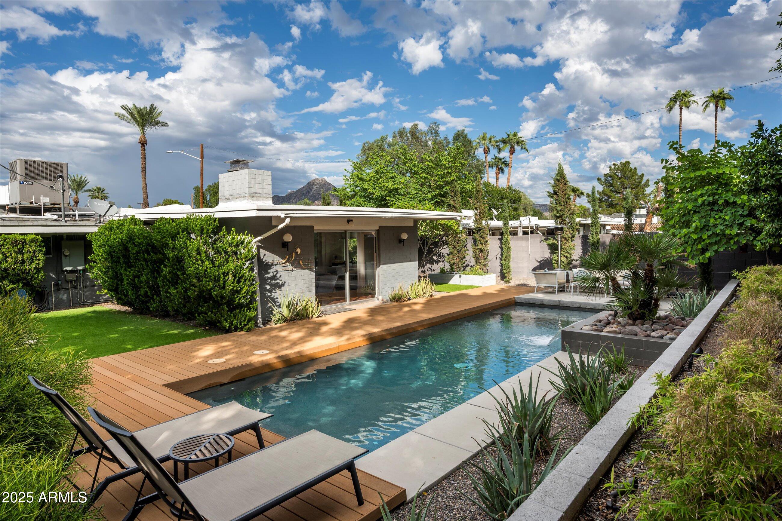 1651 East Rovey Avenue Phoenix, AZ 85016 - Photo 34 of 44 a view of a house with swimming pool and sitting area