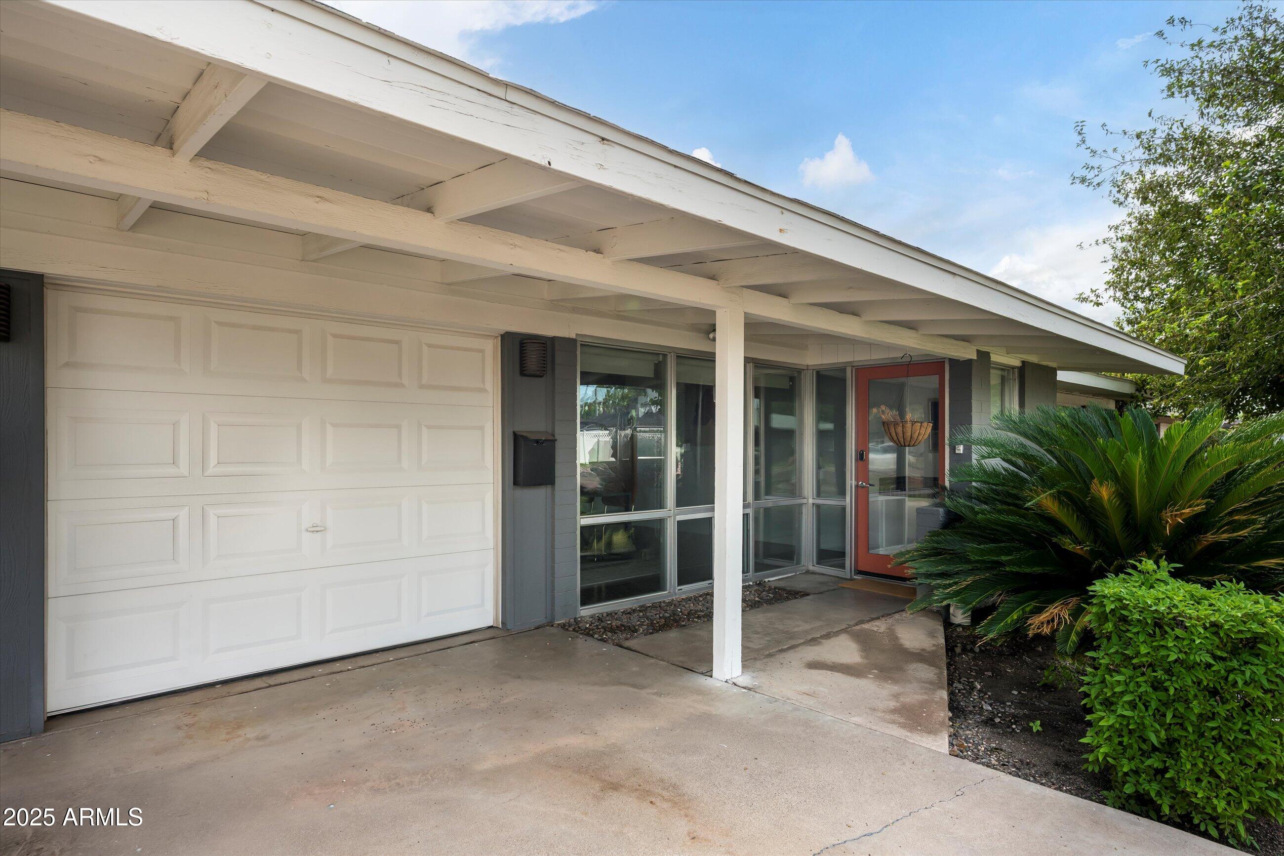 1651 East Rovey Avenue Phoenix, AZ 85016 - Photo 42 of 44 a backyard of a house with plants and trees