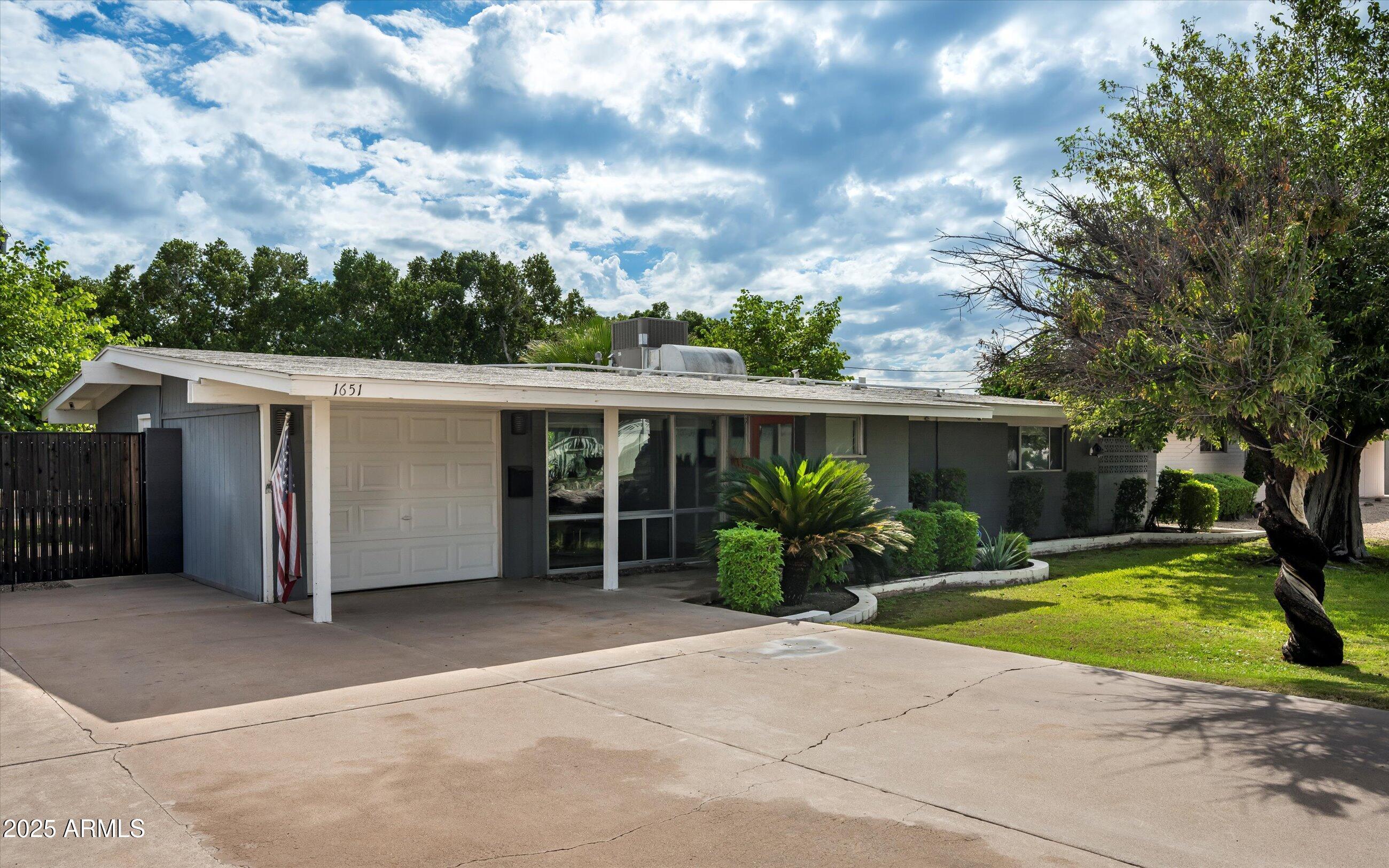 1651 East Rovey Avenue Phoenix, AZ 85016 - Photo 43 of 44 a view of a house with backyard and porch