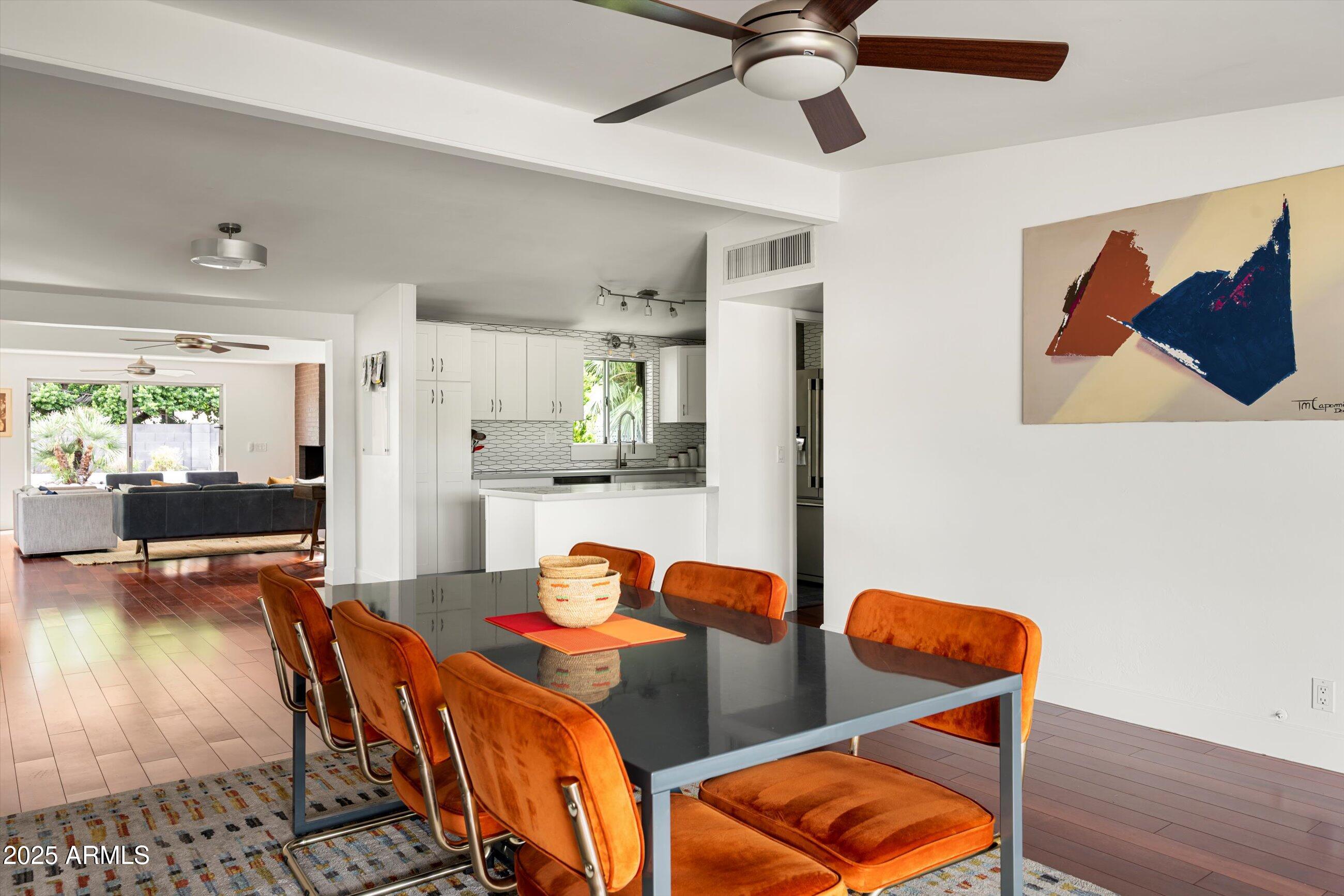 1651 East Rovey Avenue Phoenix, AZ 85016 - Photo 8 of 44 a view of a dining room with furniture and wooden floor