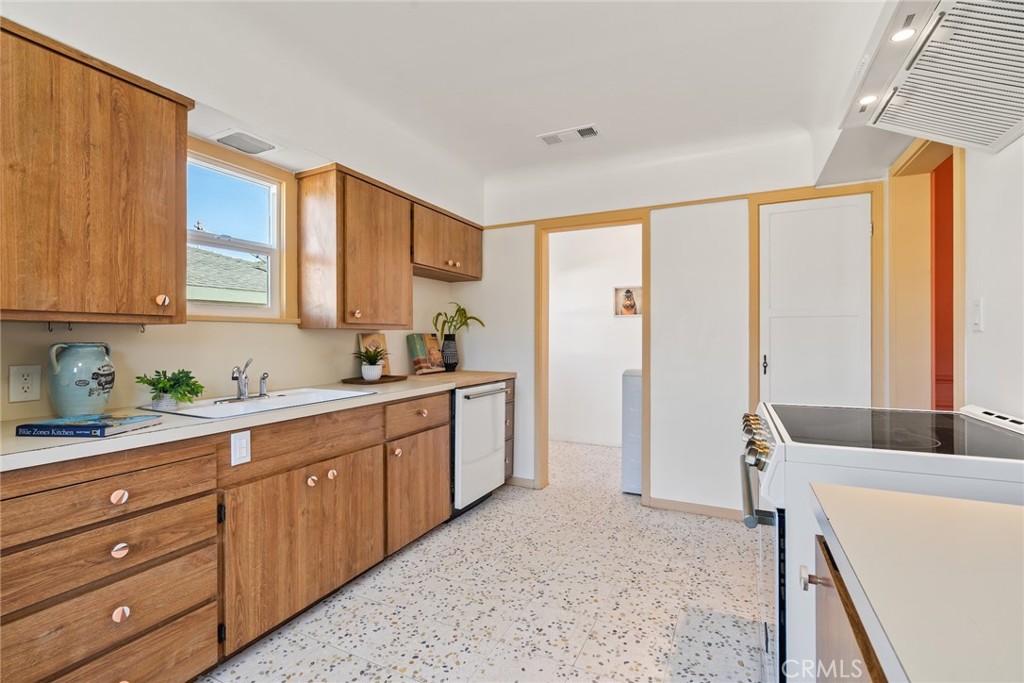 3912 York Boulevard Los Angeles, CA 90065 - Photo 20 of 51 a kitchen with stainless steel appliances granite countertop a sink window and cabinets
