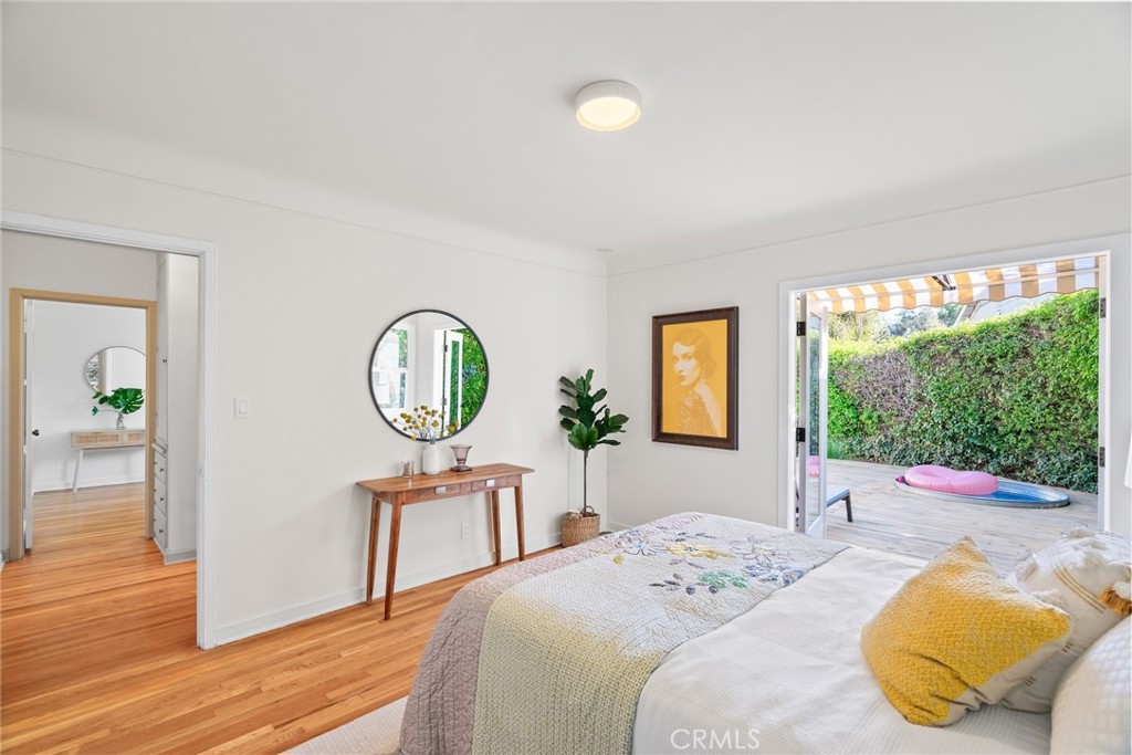 3912 York Boulevard Los Angeles, CA 90065 - Photo 31 of 51 a bedroom with a bed a dresser and a large window with outer view
