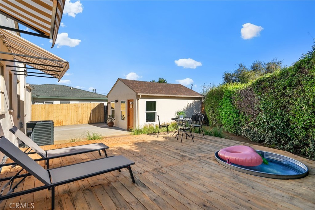 3912 York Boulevard Los Angeles, CA 90065 - Photo 32 of 51 a backyard of a house with table and chairs