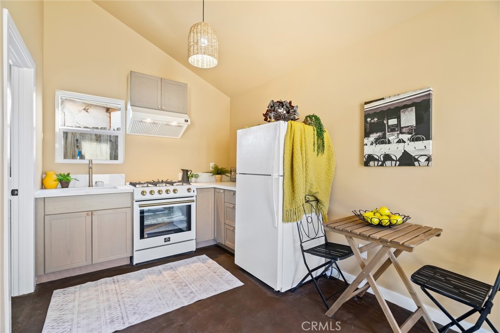 3912 York Boulevard Los Angeles, CA 90065 - Photo 41 of 51 a kitchen with stainless steel appliances granite countertop a refrigerator and a stove top oven