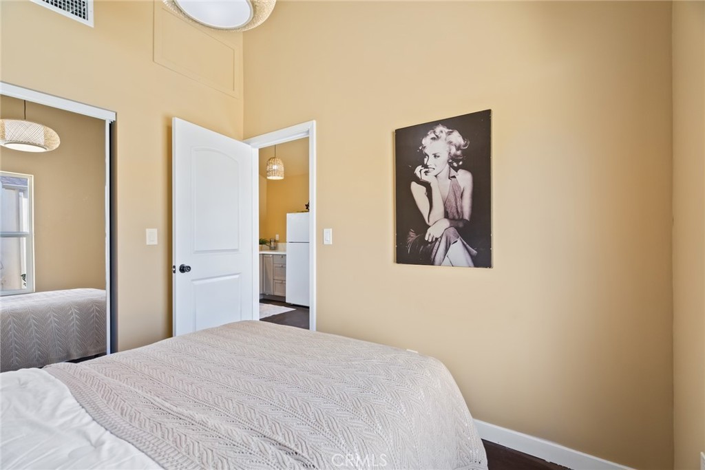 3912 York Boulevard Los Angeles, CA 90065 - Photo 44 of 51 a bedroom with a bed and painting on the wall