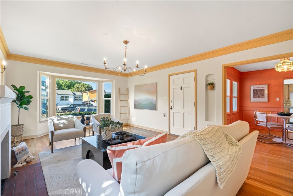 3912 York Boulevard Los Angeles, CA 90065 - Photo 10 of 51 a living room with furniture a chandelier and a dining table