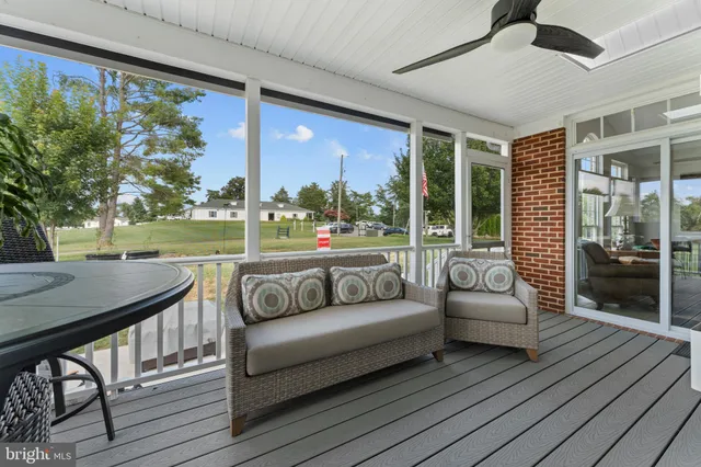 a balcony with furniture and a garden