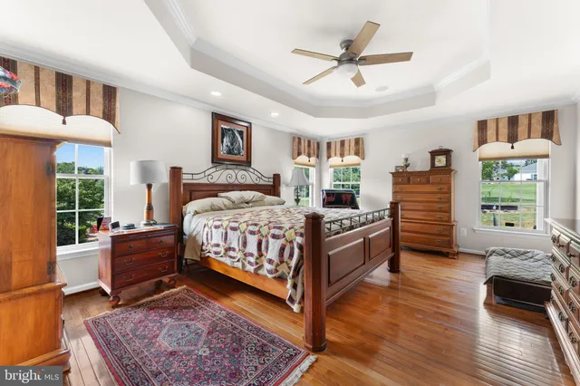 a bedroom with a bed and a dresser in it