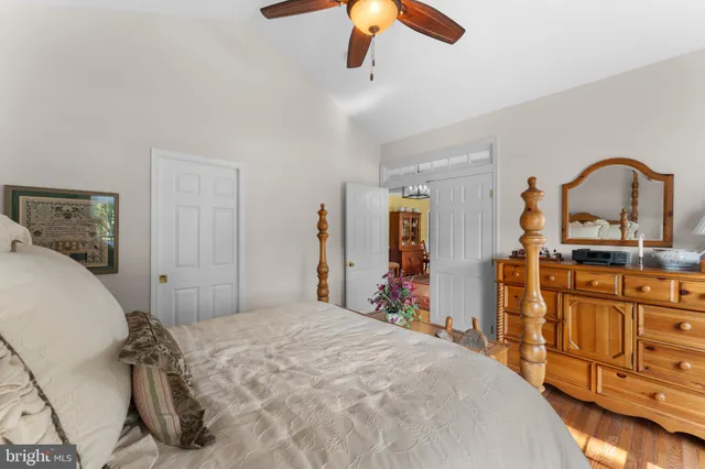a bedroom with a bed and dresser