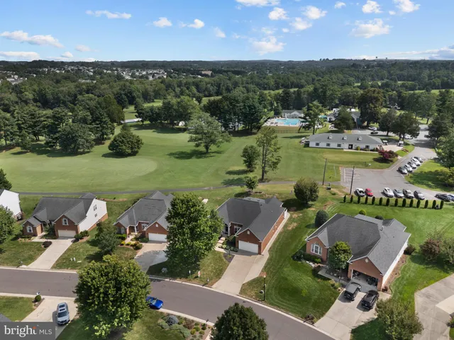an aerial view of a house with outdoor space swimming pool outdoor seating yard and mountain view