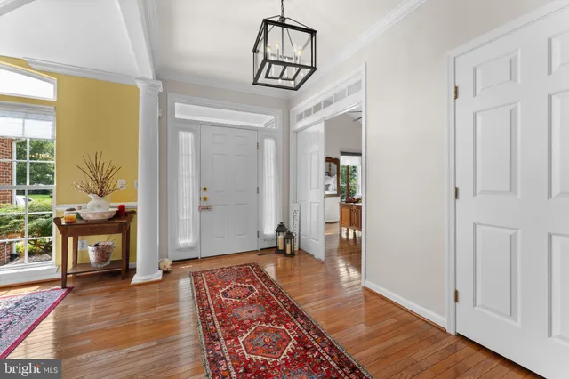 a very nice looking room with wooden floor and a rug