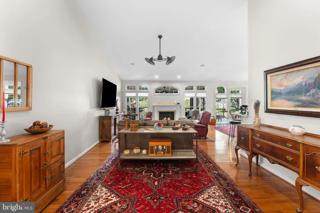 a living room with fireplace furniture and a flat screen tv
