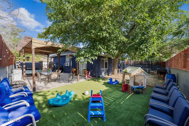 an aerial view of a house with yard swimming pool and outdoor seating