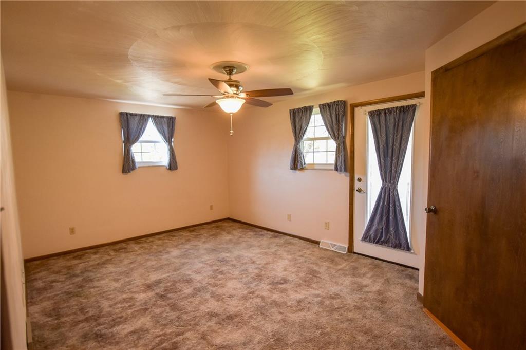 210 Cole Road Sarver, PA 16055 - Photo 9 of 22 an empty room with windows and fan