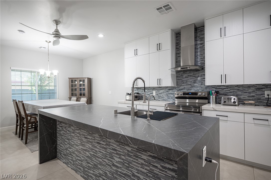 441 Belville Road Pahrump, NV 89048 - Photo 12 of 44 A well-appointed kitchen showcasing an inviting island and sleek, modern finishes.