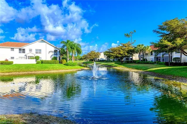 a view of a lake with a house in the background