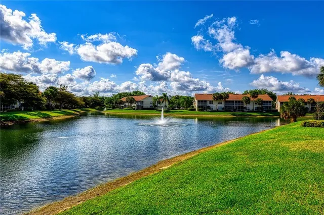 a view of a lake in middle of a house with a lake view