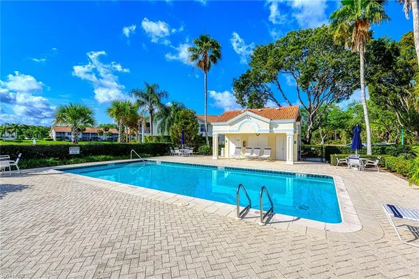 a view of swimming pool with lounge chair
