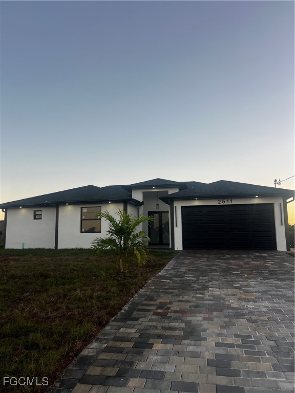 2511 30th Street Southwest Lehigh Acres, FL 33976 - Photo 1 of 15 a house view with a garden space