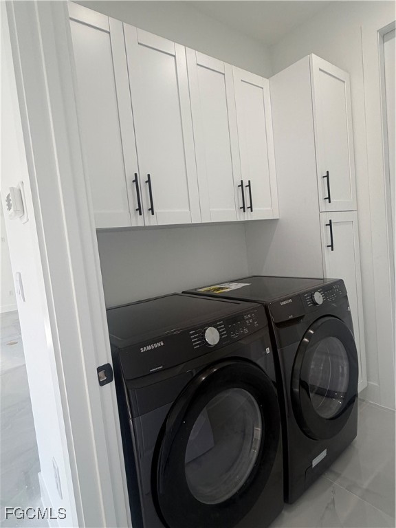 2511 30th Street Southwest Lehigh Acres, FL 33976 - Photo 13 of 15 a utility room with dryer and washer