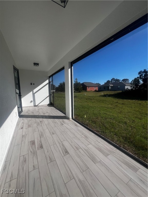 2511 30th Street Southwest Lehigh Acres, FL 33976 - Photo 14 of 15 a view of a room with wooden floor