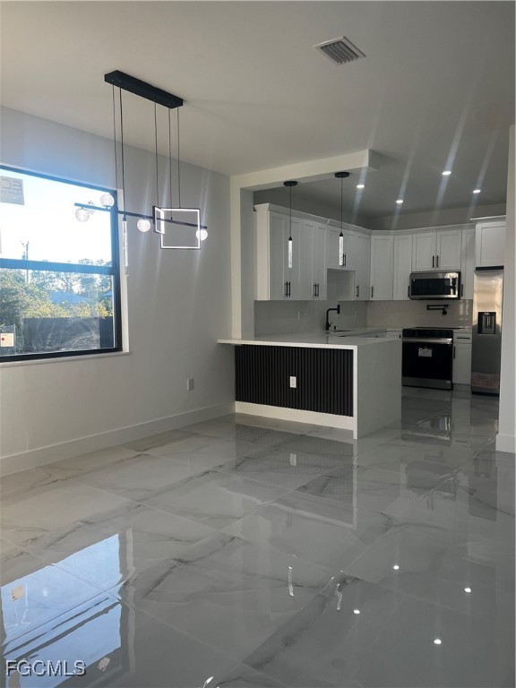 2511 30th Street Southwest Lehigh Acres, FL 33976 - Photo 7 of 15 a view of kitchen and window