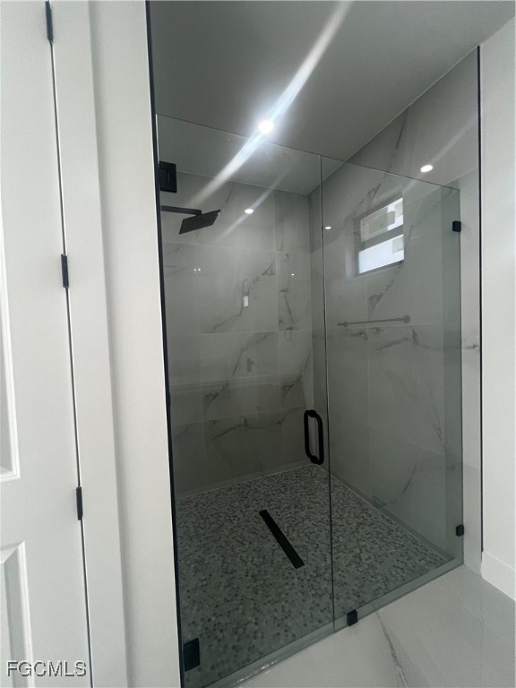 2511 30th Street Southwest Lehigh Acres, FL 33976 - Photo 10 of 15 a bathroom with a shower