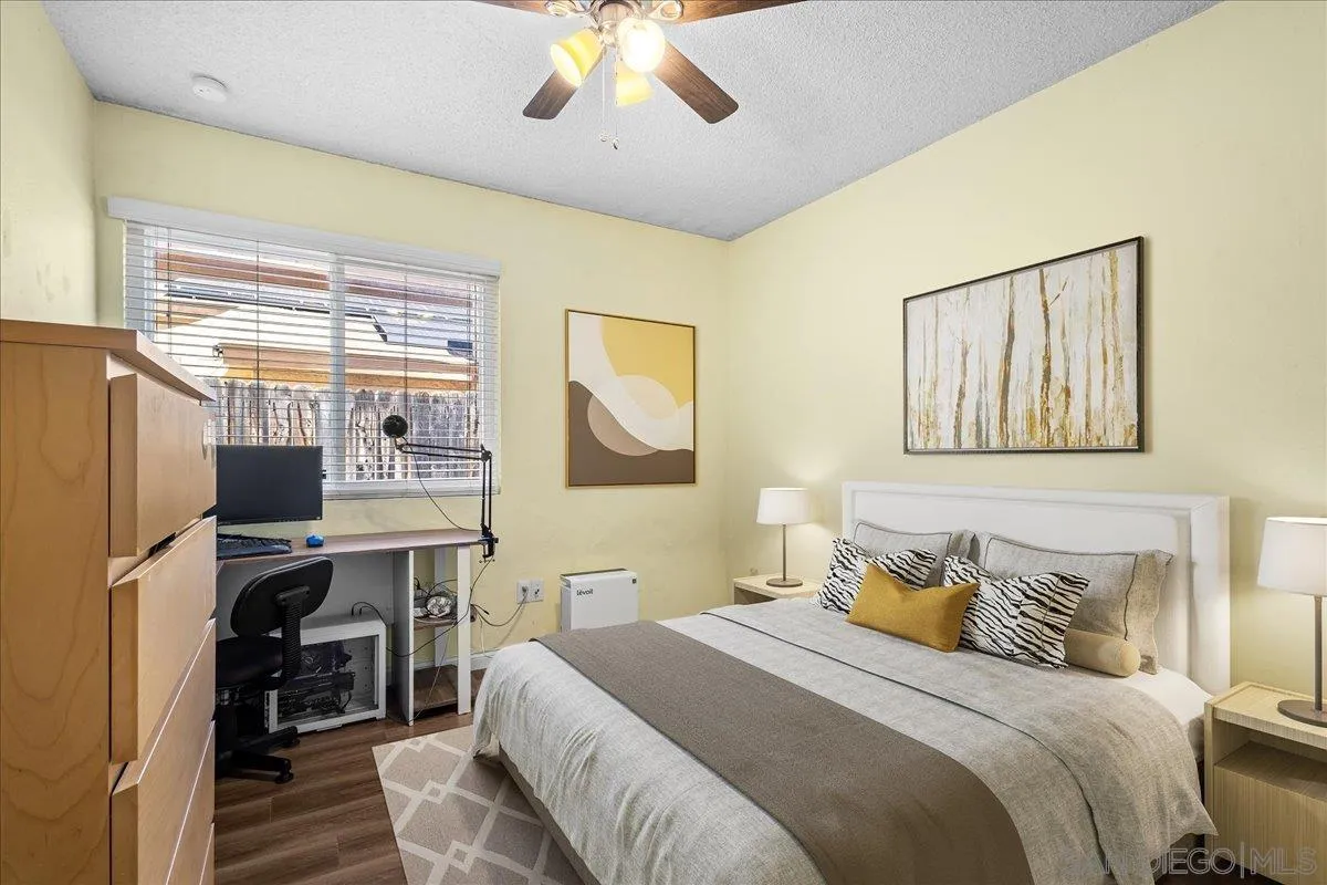 10738 2nd Street Santee, CA 92071 - Photo 16 of 52 a bedroom with a bed wooden floor and window
