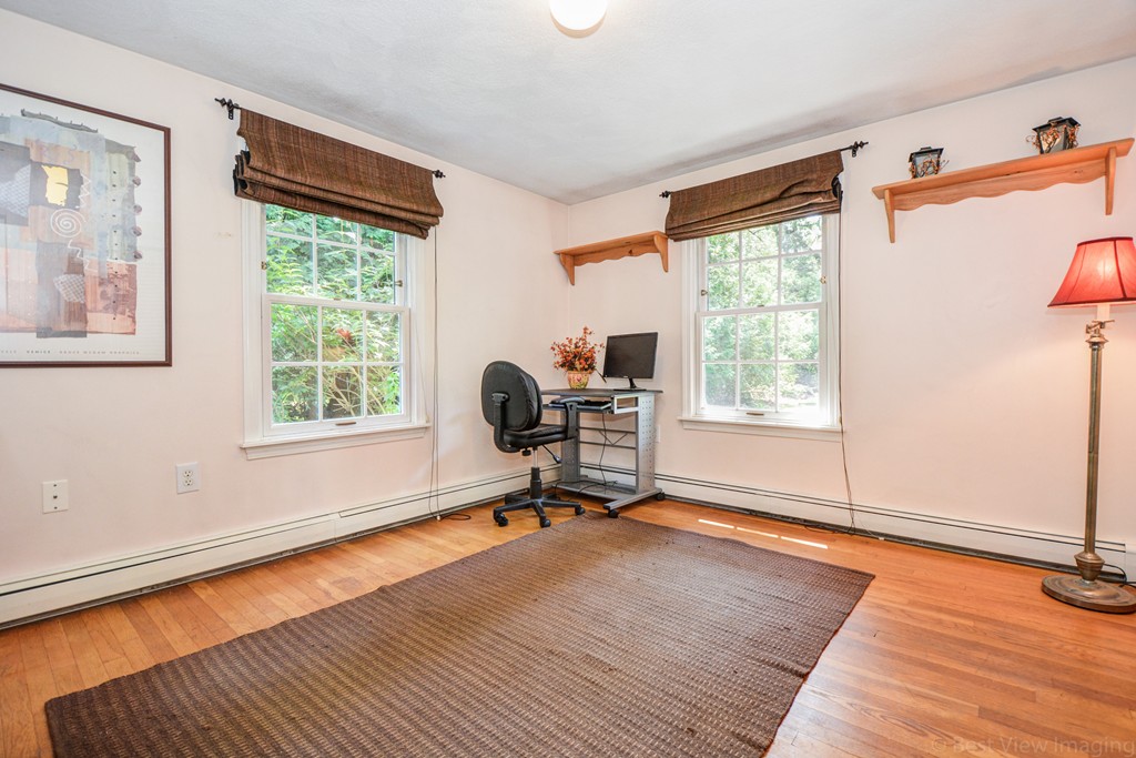 174 New Estate Road Littleton, MA 01460 - Photo 20 of 30 a view of a livingroom with workspace and a window