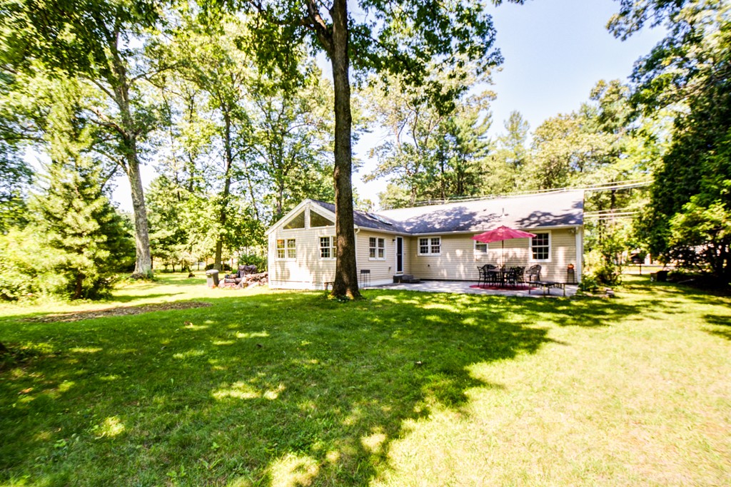 174 New Estate Road Littleton, MA 01460 - Photo 28 of 30 a front view of house with yard and green space