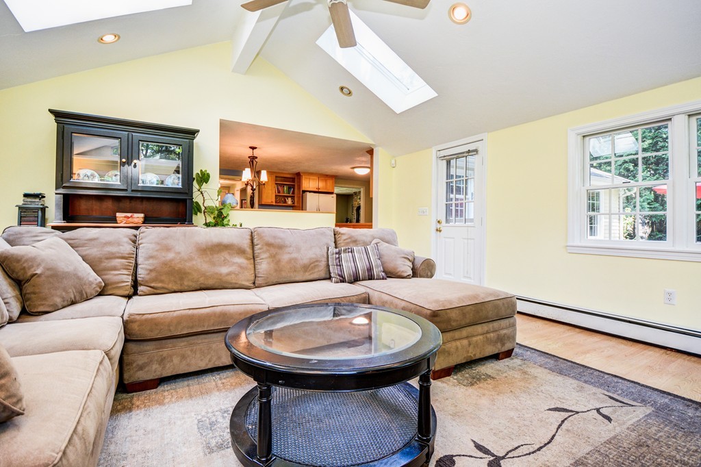 174 New Estate Road Littleton, MA 01460 - Photo 4 of 30 a living room with furniture and a painting on the wall