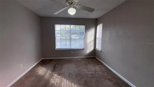 a bathroom with a sink a light fixture and a mirror