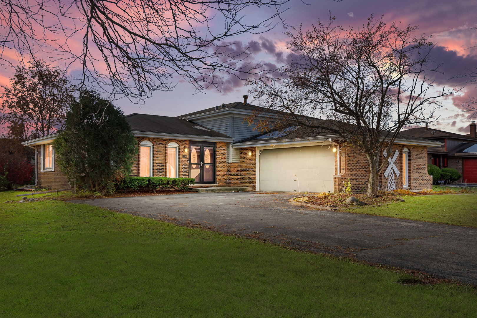 front view of a house with a yard