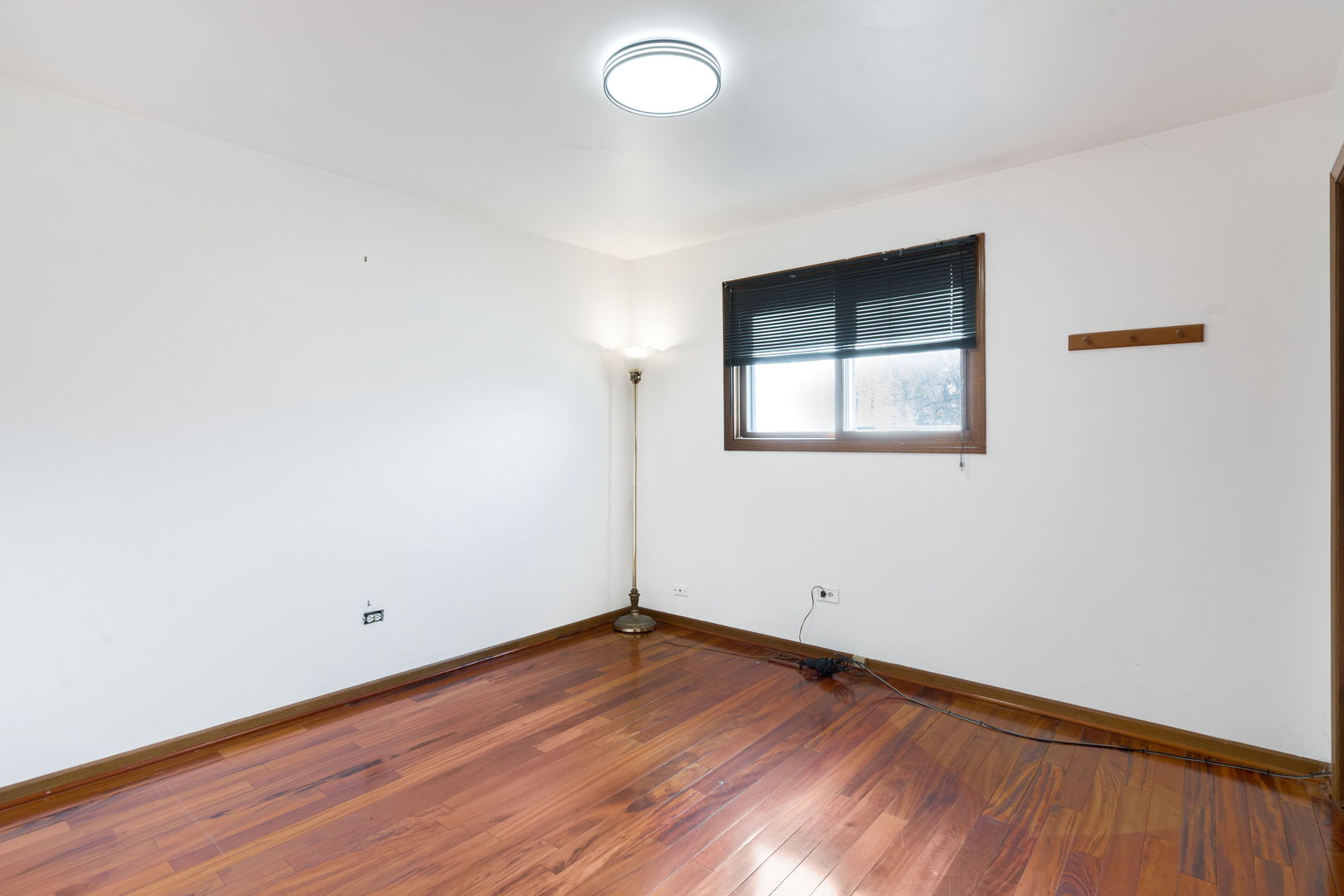 1200 Jacqueline Drive Crete, IL 60417 - Photo 14 of 21 an empty room with wooden floor and windows