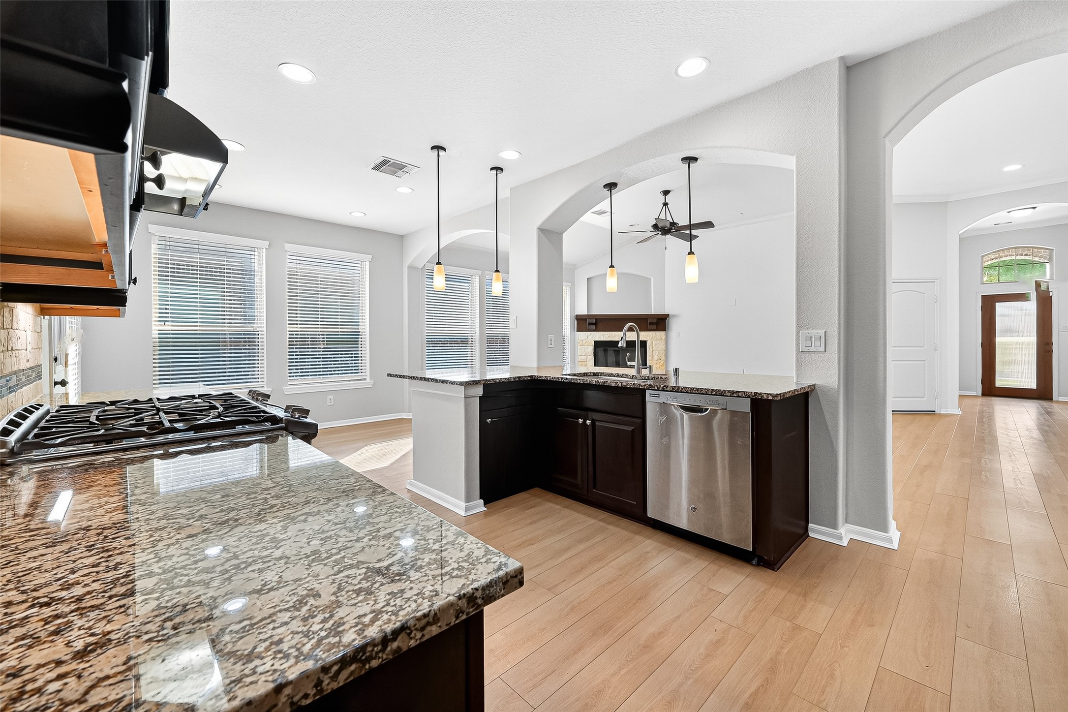 1531 Kent Valley Lane Rosenberg, TX 77471 - Photo 15 of 37 a kitchen with stainless steel appliances granite countertop a stove and a wooden floors