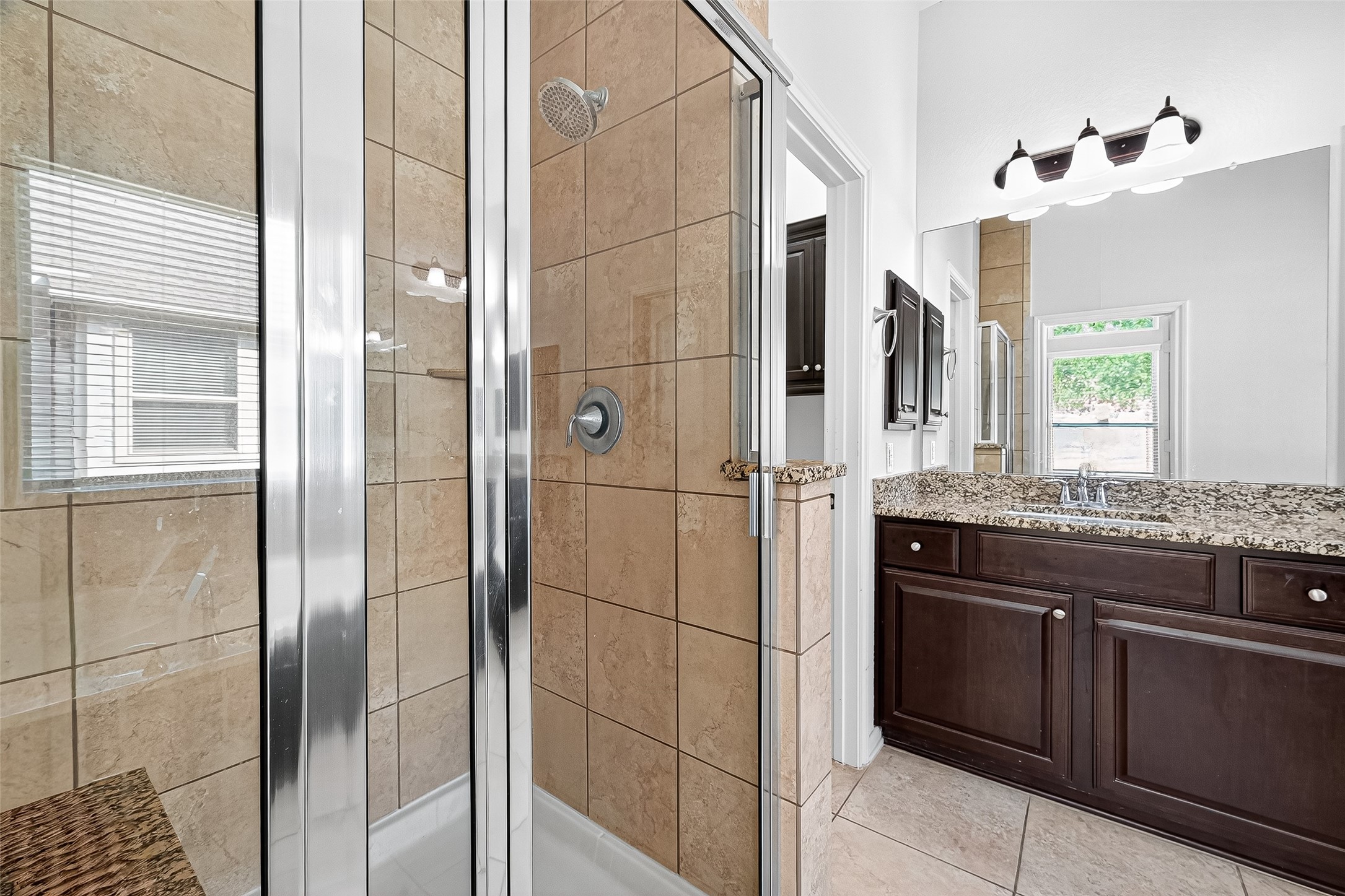 1531 Kent Valley Lane Rosenberg, TX 77471 - Photo 21 of 37 a bathroom with a granite countertop shower sink and mirror