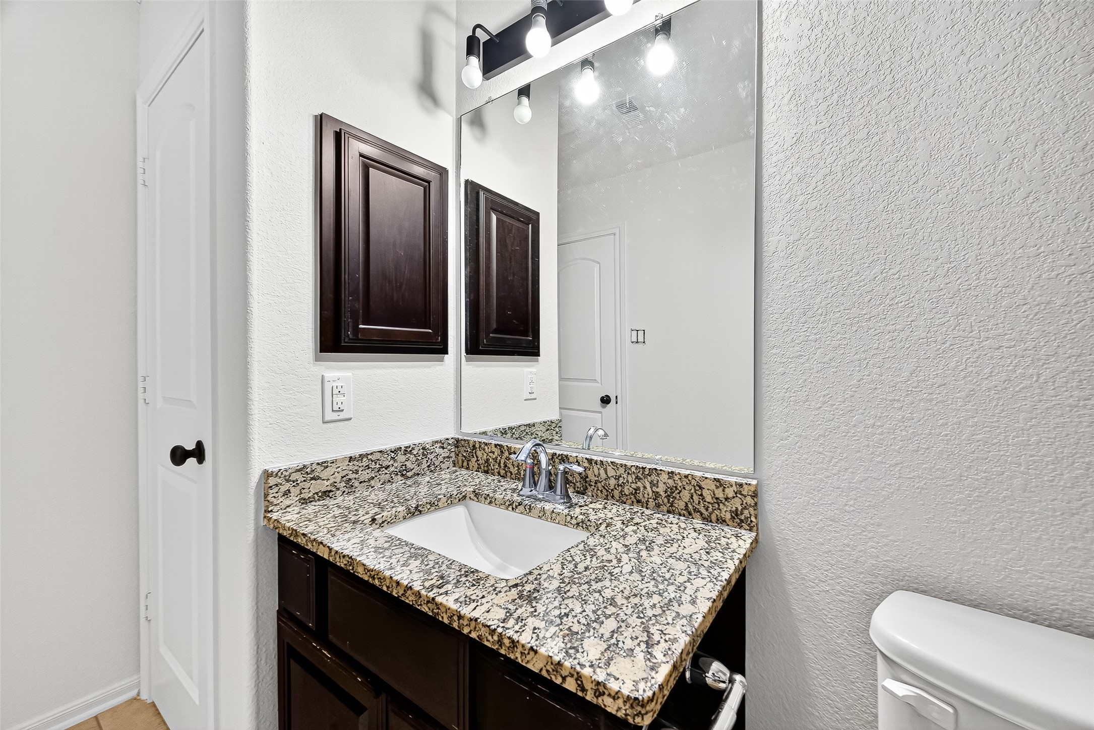 1531 Kent Valley Lane Rosenberg, TX 77471 - Photo 31 of 37 a bathroom with a granite countertop sink and a mirror
