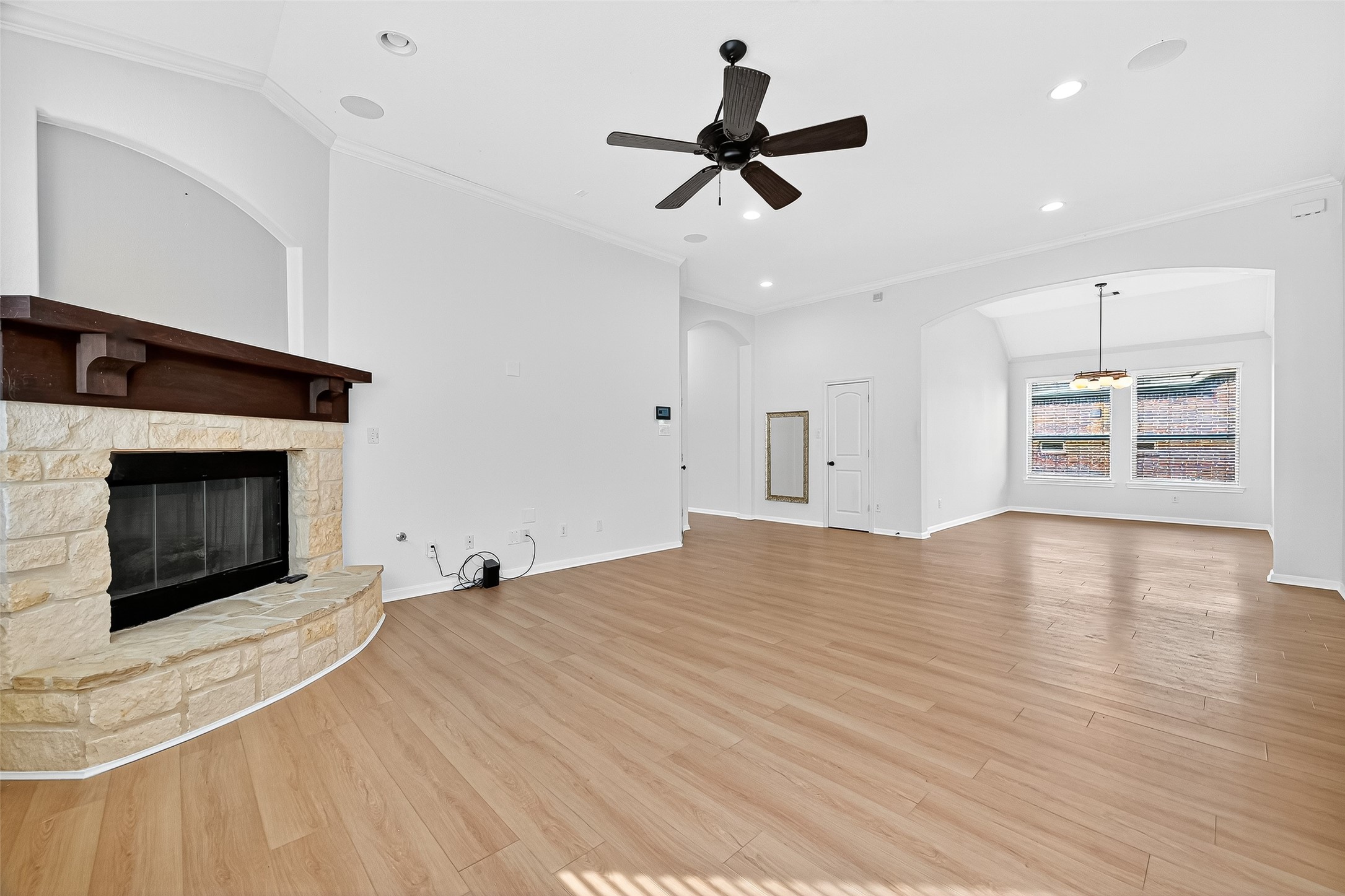 1531 Kent Valley Lane Rosenberg, TX 77471 - Photo 7 of 37 a view of empty room with wooden floor and fireplace