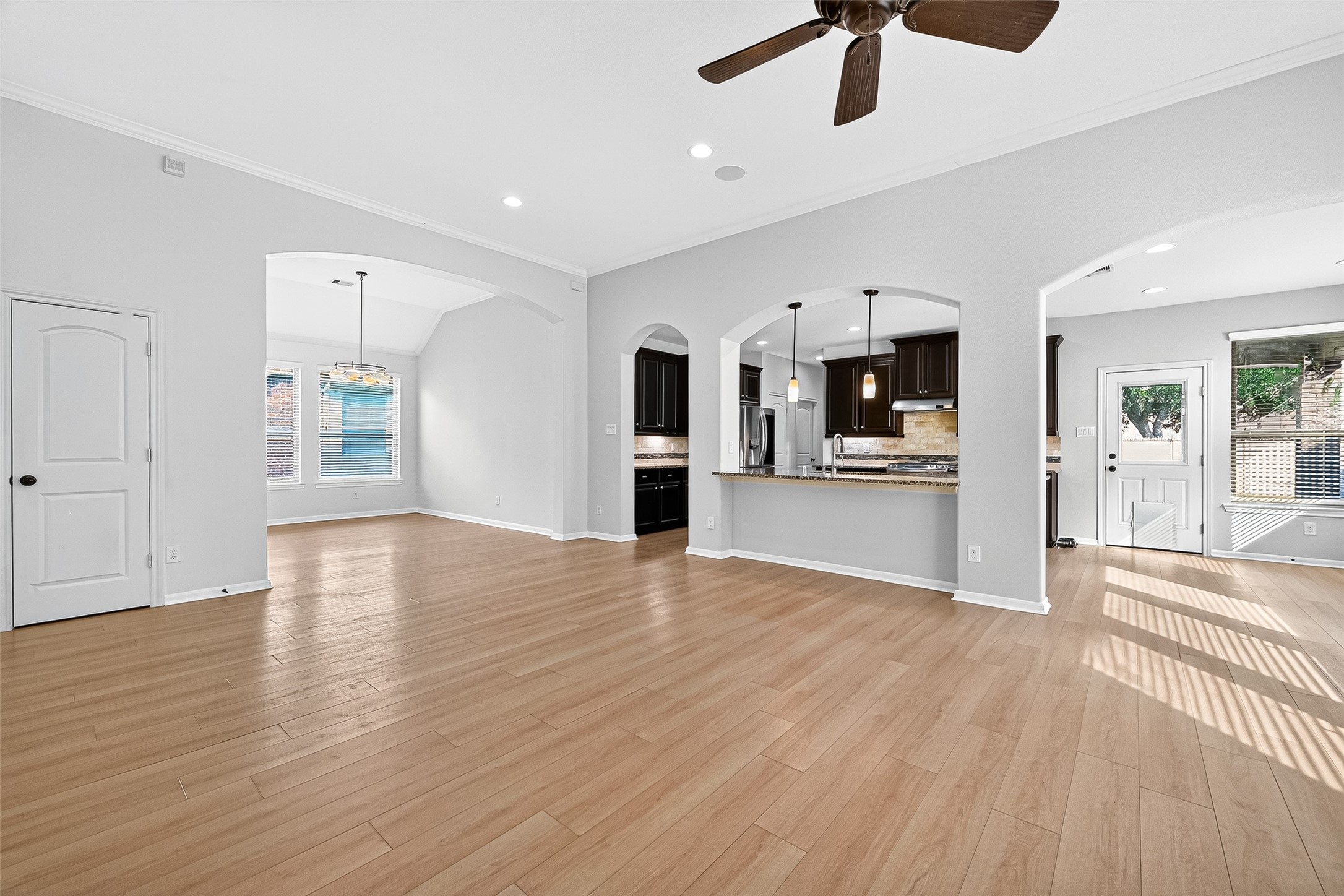 1531 Kent Valley Lane Rosenberg, TX 77471 - Photo 8 of 37 a view of a kitchen with a microwave and a stove top oven