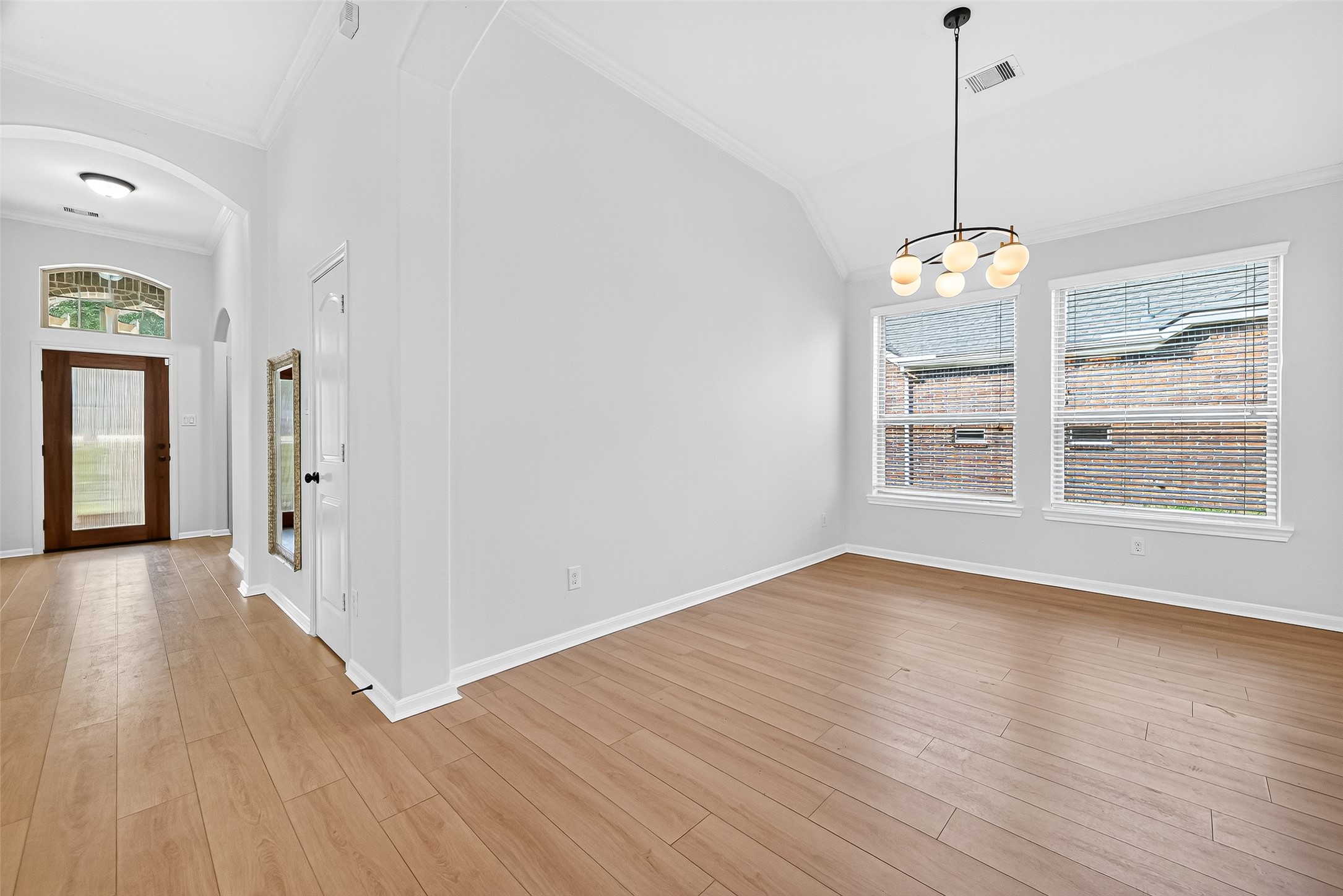 1531 Kent Valley Lane Rosenberg, TX 77471 - Photo 10 of 37 a view of an empty room with wooden floor and a window