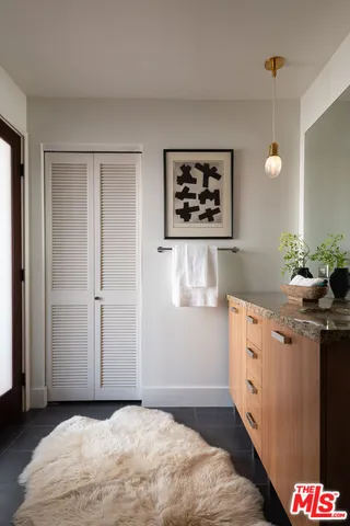 a kitchen with a refrigerator and a stove