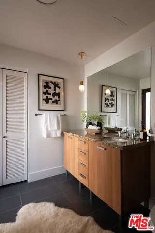 a kitchen with sink and cabinets