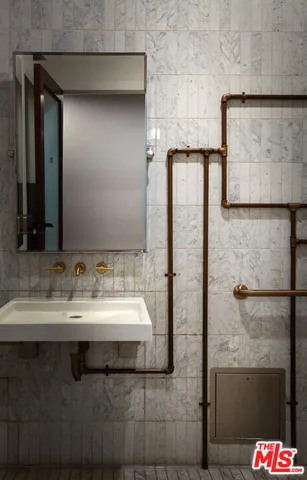 a view of a backyard with table and chairs and potted plants