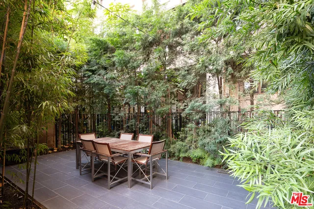 a backyard of a house with outdoor seating