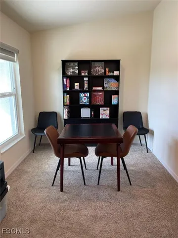 a workspace with furniture and window